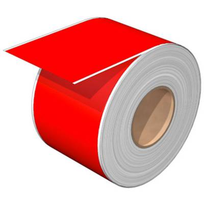 A thick, red ribbon of paper lies rolled up, with one end protruding upwards and showing a free edge.