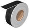 A roll of black adhesive tape, partially unrolled, on a white background.