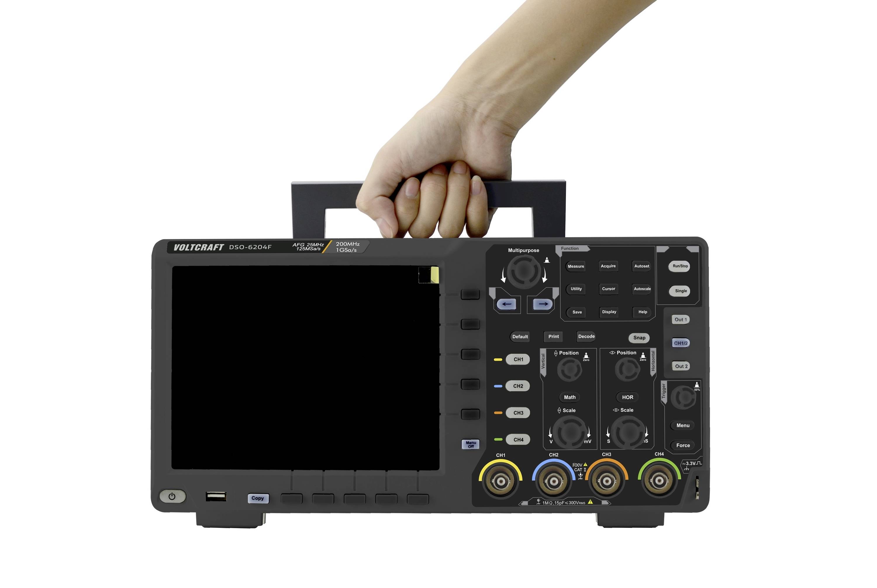 A hand is holding a portable oscilloscope with a black screen. The device shows multiple control elements and colourful connectors on the front panel.