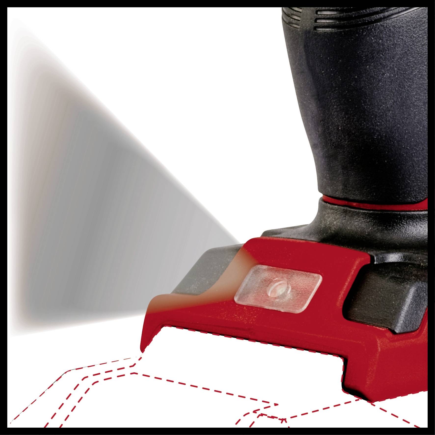 A handheld vacuum cleaner whilst vacuuming on a textured surface, with a red suction head and black handle, demonstrating the suction and cleaning function.