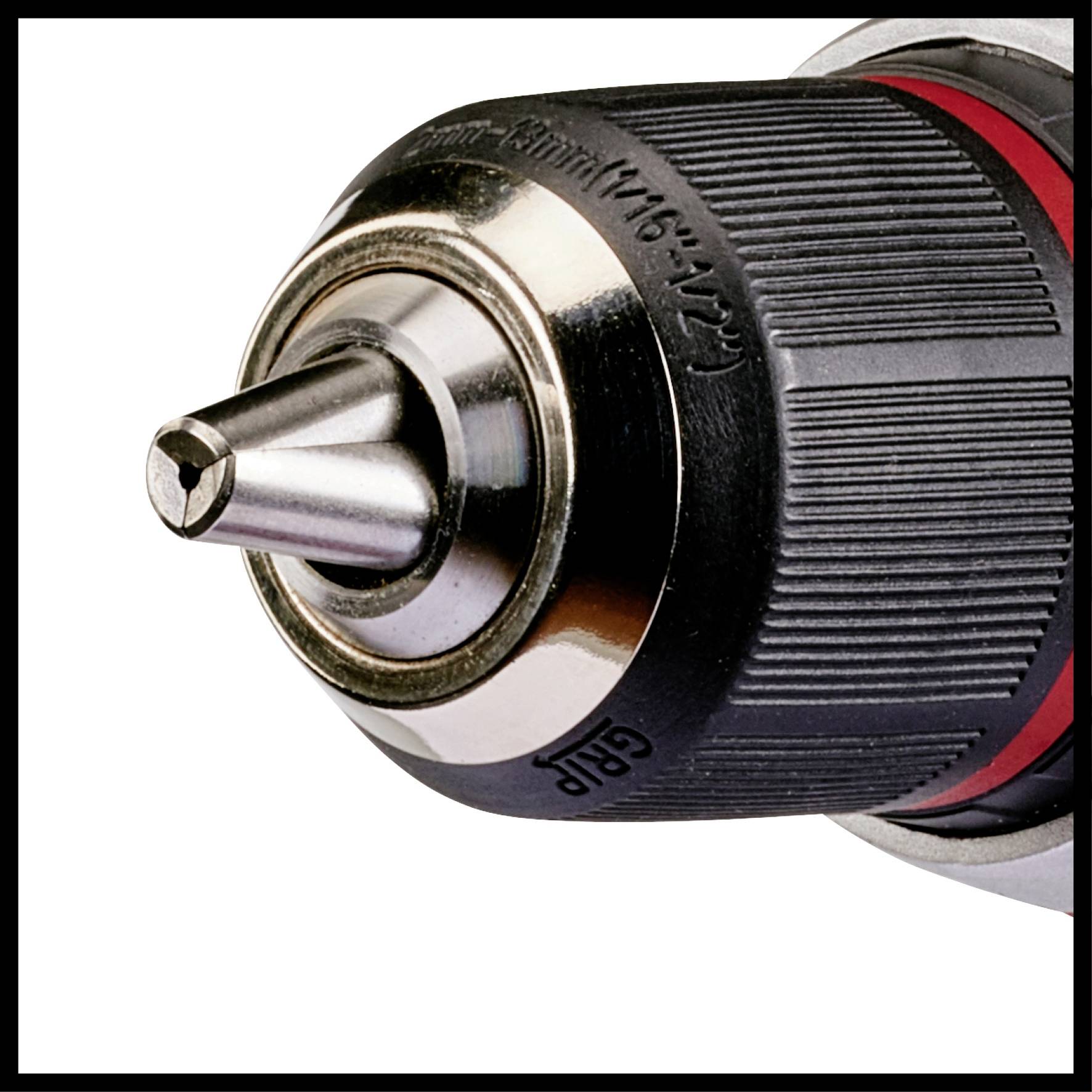 Close-up of a drill chuck with a drill bit clamped in place. The drill chuck has a black and silver surface.