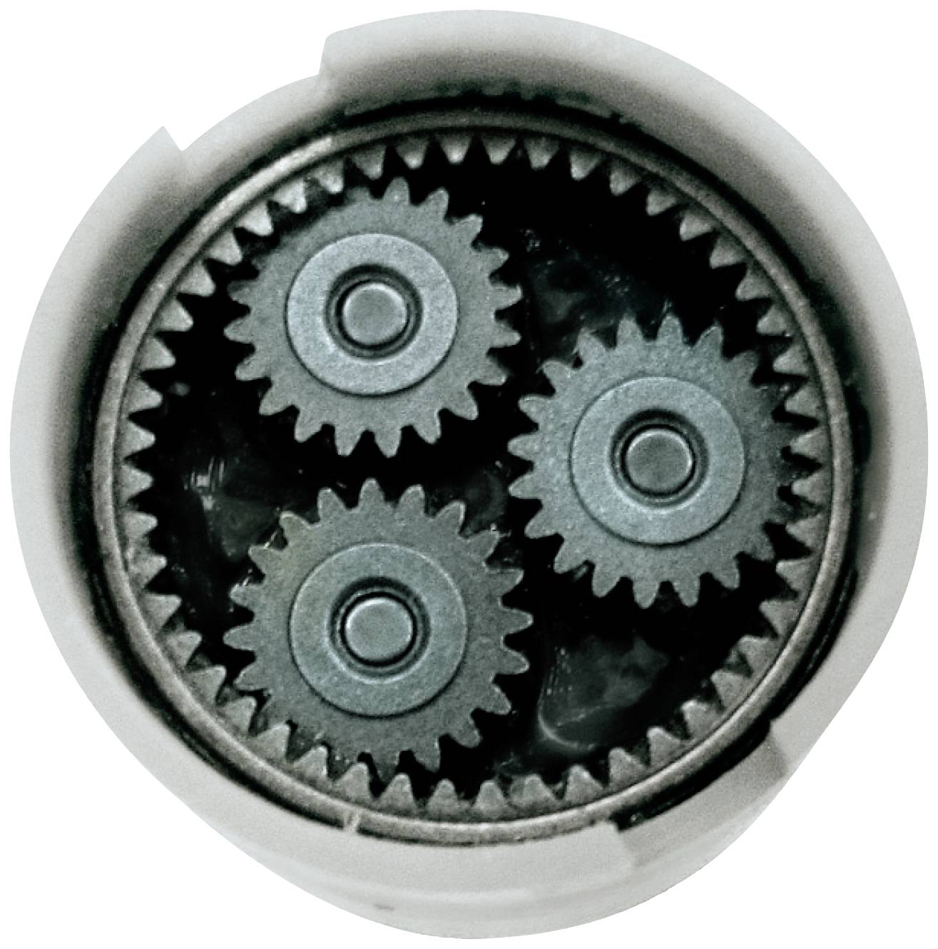 Three small gears surround a larger gear in a circular housing, typical of a planetary gearbox.