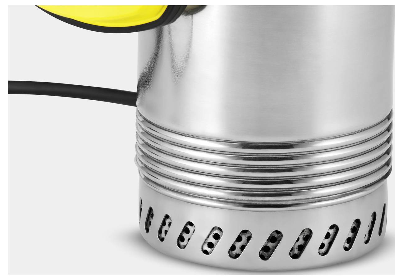 Close-up of a silver metal heater with a ribbed handle and ventilation holes, partially visible black cord extending from its side.