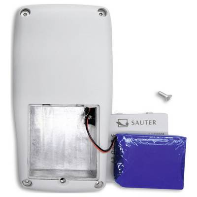 An open battery compartment of a device with a blue battery next to it. A screw is lying loosely nearby.