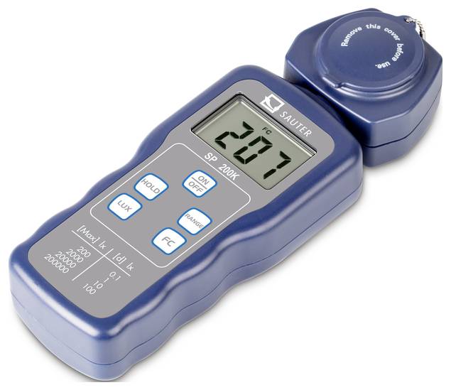 Digital light meter with removable sensor opening, displaying 207 fc. Used for measuring light intensity in photography or lighting design.