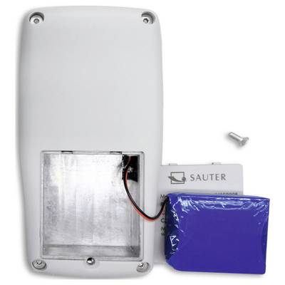 An open battery compartment with a removable battery and a small screw beside it.