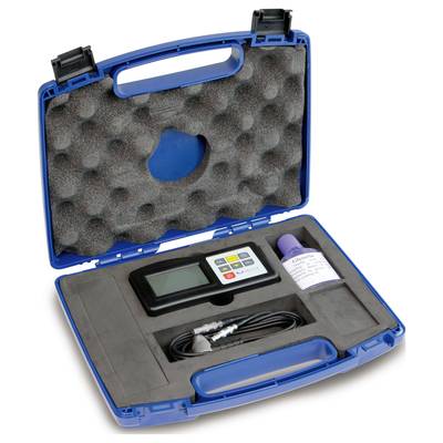 An open blue suitcase with foam cut-outs contains a digital measuring device, cables, and a bottle of liquid.