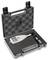Portable hardness tester in a black plastic case with foam lining. Includes the device, batteries, and accessories.