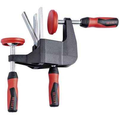 Two red G-clamps with ergonomic handles, mounted in a black holder. They are used for holding workpieces.