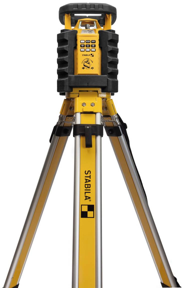 A yellow laser level on an aluminium tripod, used for precise height measurements in construction projects.