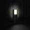 A standing outdoor light with a rectangular, illuminated shade against a dark wooden wall creates an atmospheric lighting effect.