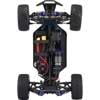 Remote-controlled car viewed from underneath, with visible chassis, motor, battery, and tyres. Technical details and structure are clearly discernible.