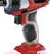 Cordless drill in close-up, red and black design, shown without battery. Focus on the ergonomic handle.