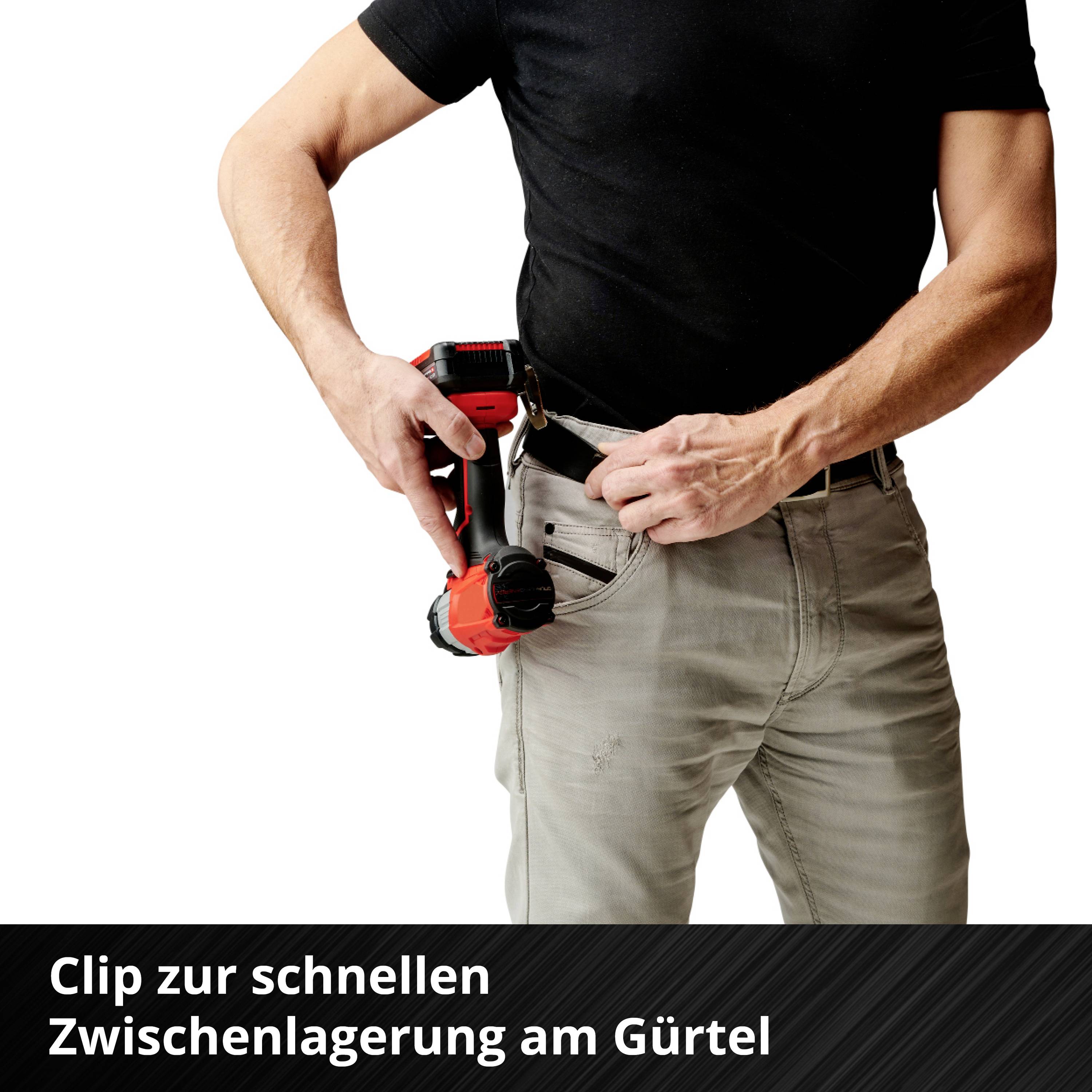 A person quickly secures a drill to their belt.