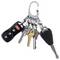 A keychain with several keys and a black car remote attached, featuring various metallic and brass keys.