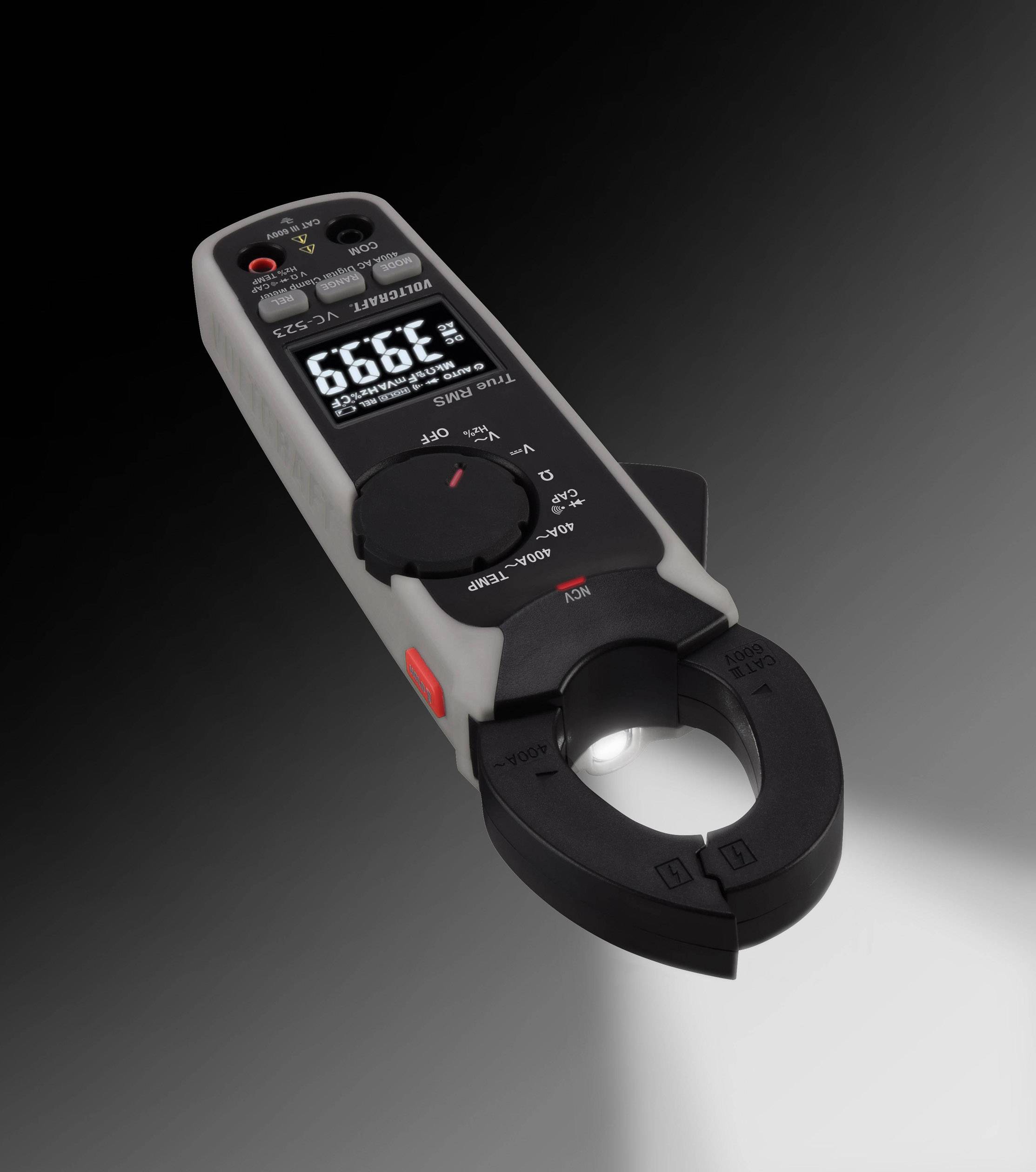 A digital electricity meter with clamp function, with a black and grey housing, displays '389.9 Hz' on the screen.