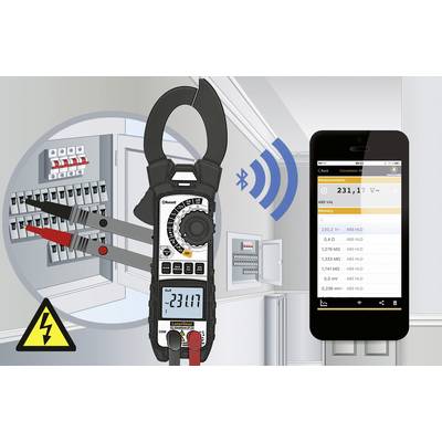 A multimeter measures voltage and wirelessly transmits data to a smartphone. In the background, electrical distribution boards are visible.