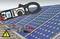 A solar panel is being tested with a digital multimeter, which displays a reading of 20.55. A high-voltage symbol is shown below.