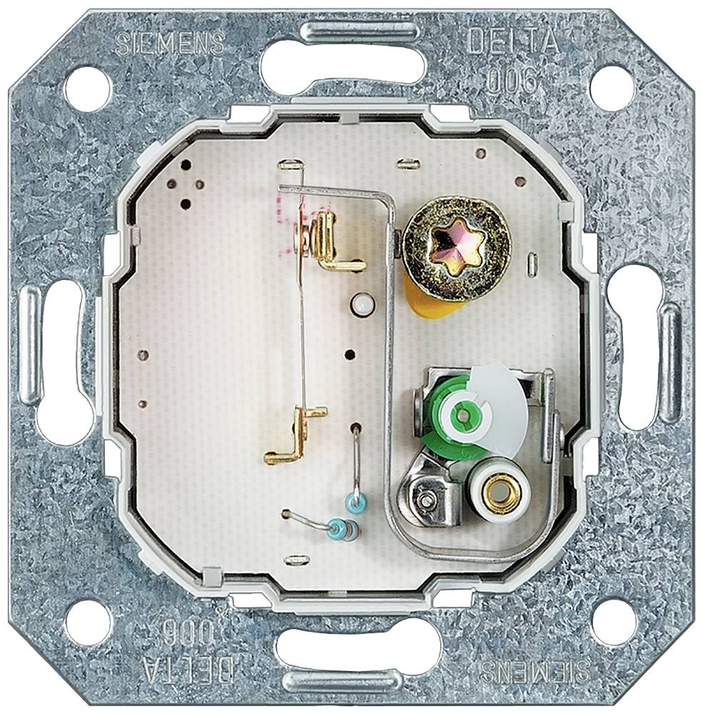 Metal frame with the internal mechanism of a switch, including screws and contact elements, for installation in a wall socket.