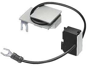 An electronic component with a black cable and a fork terminal, attached to a silver metal casing.