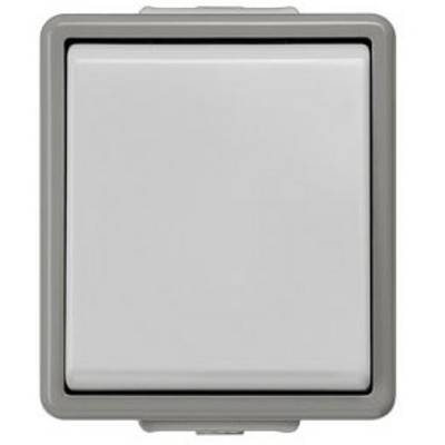 A rectangular, grey light switch in close-up. The switch has a slightly recessed surface and is surrounded by a frame.