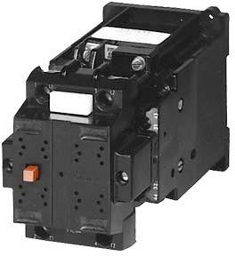 A black electric contactor with a red button. Main component of an electrical switching system.