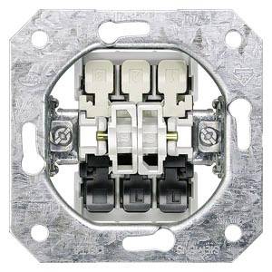 A metal flush-mounted switch without a cover, with visible screws and electrical installation connections.