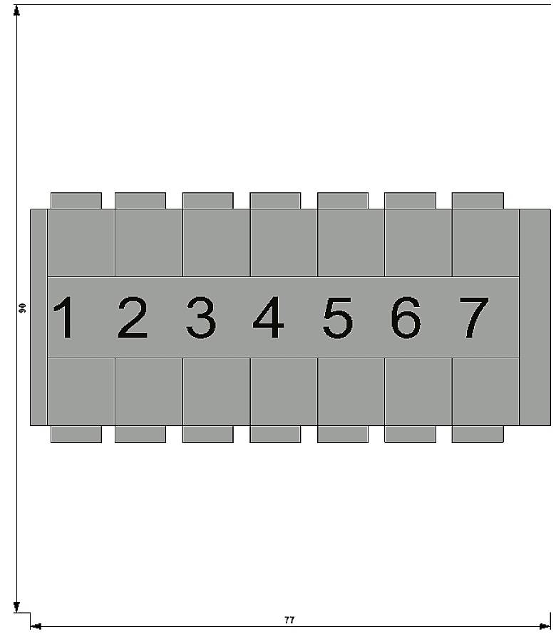 Grey rectangular chip with numbers 1 to 7 in black on the front side, surrounded by 14 connections, seven on each side.