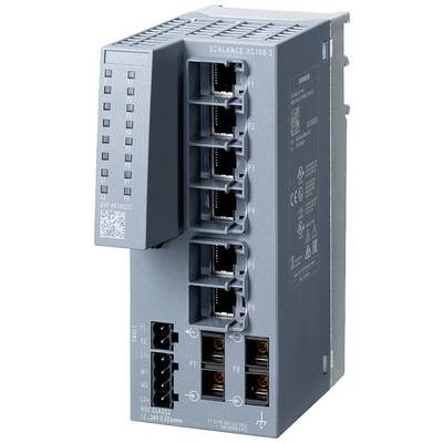 A grey network switch with eight Ethernet ports, four on the top and four on the bottom. Status LED indicators are positioned on the left-hand side.