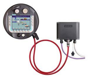 An electronic control unit with a display and cables. The display shows a digital image. The device has multiple ports.