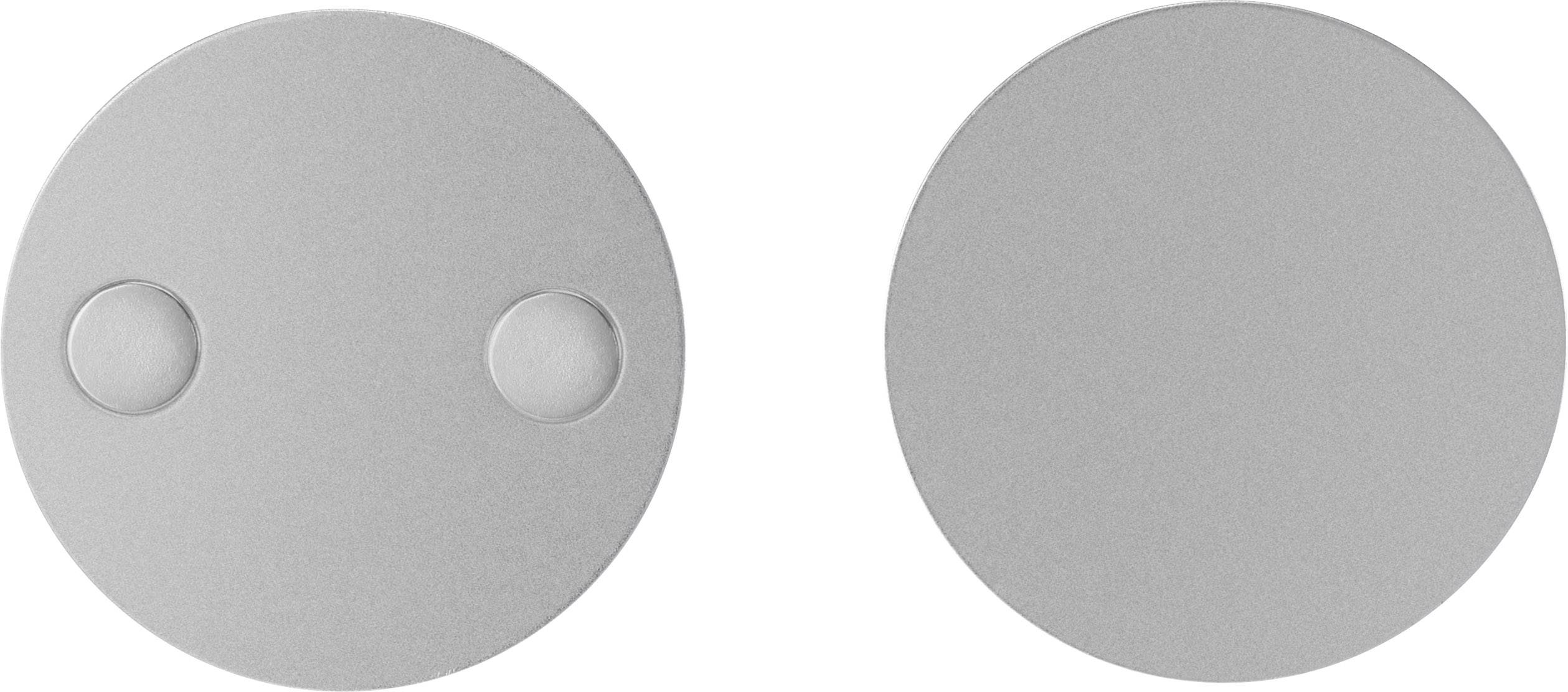 Two silver round magnets, with one on the left featuring two small protrusions, and a smooth magnet on the right.
