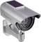 A silver surveillance camera mounted externally, with a solar panel on its top surface.