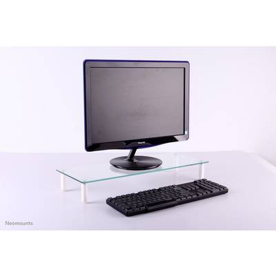 Computer monitor and keyboard on a desk with a glass shelf, against a white background.