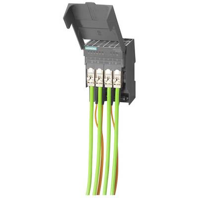 A grey open electrical junction block with four connected green cables and one orange cable, used in control engineering.
