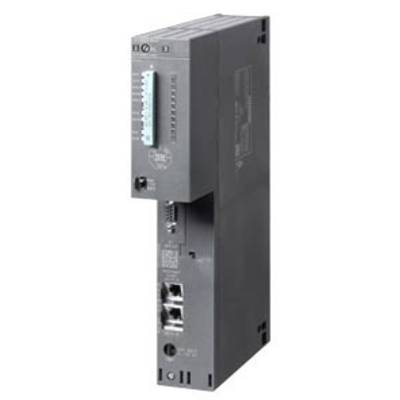 A grey electronic module with multiple ports and switches on the side, likely an industrial or control device.