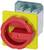 A red emergency stop switch on a yellow background, used in electrical systems for safety isolation.