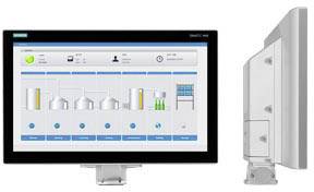 A monitor displays a process monitoring system with multiple graphical elements and diagrams. To the right, a side view of the monitor.