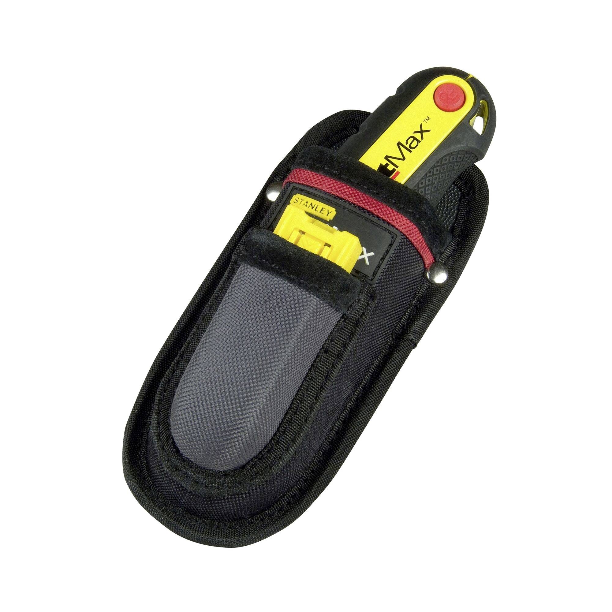 A yellow measuring tape in a black belt holster; the 'Stanley Fatmax' brand is visible. The holster has a red and black fastener.