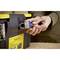 A hand is securing a black toolbox with a padlock. The box has yellow details and a label.