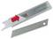 A geometric replacement blade knife with a blade in a transparent plastic box. A red arrow indicator shows how to remove it.