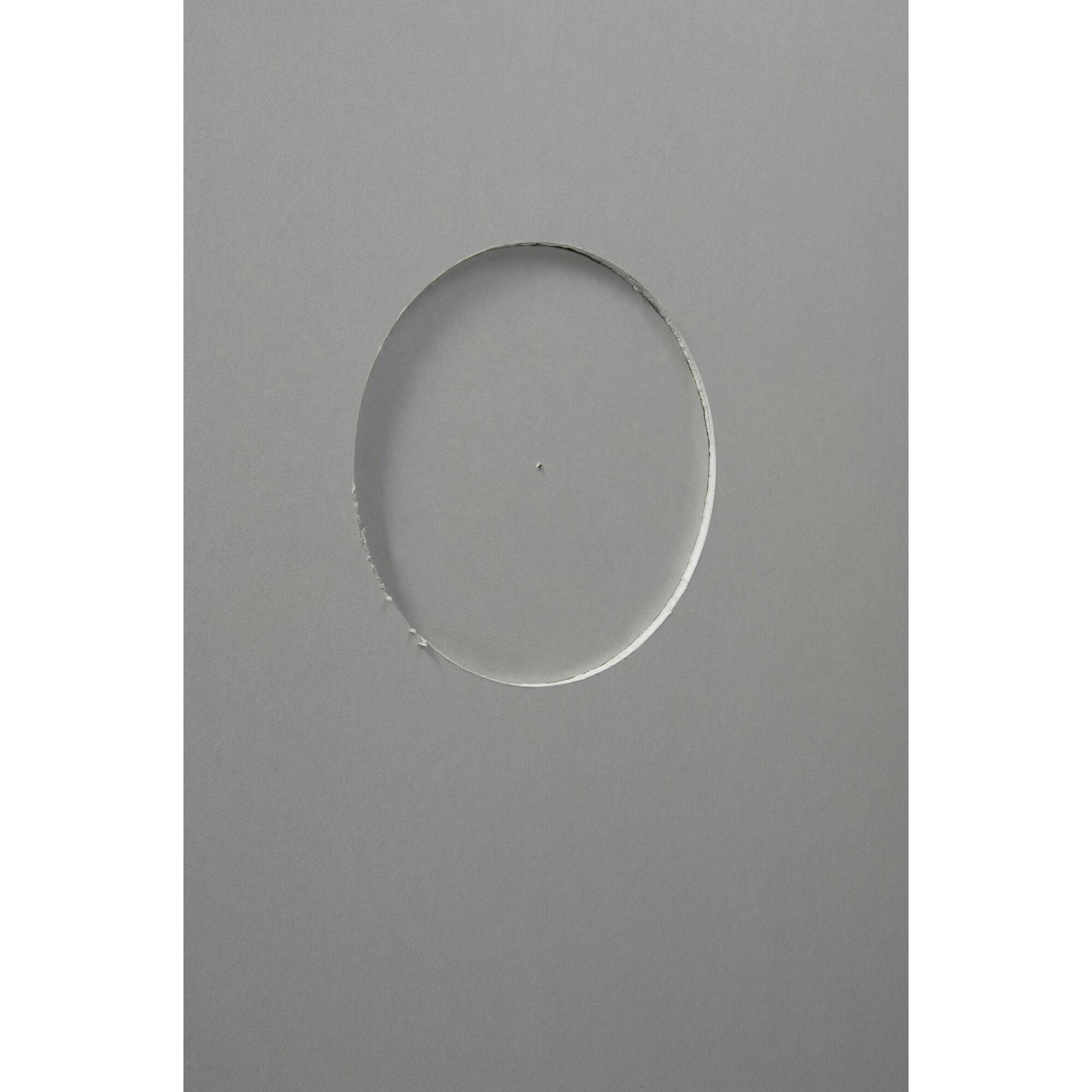 Grey surface with an oval, vertically centred cut or shadow.