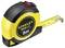 A yellow tape measure with the inscription 'Stanley DualLock 5m' is partially unrolled and has a black protective cover.