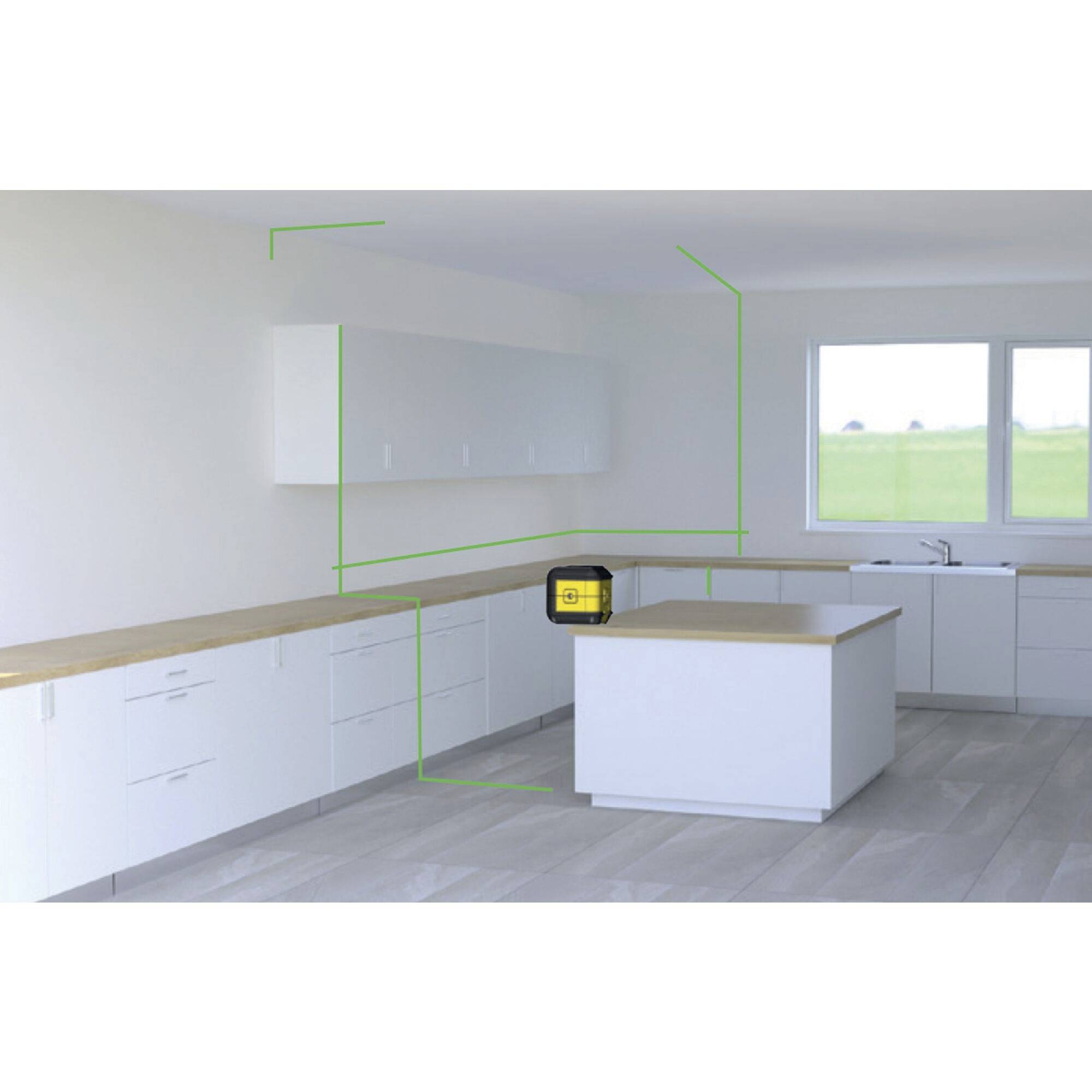 Spacious, bright kitchen with white cupboards, wooden table and a laser level measuring device standing on a worktop for alignment.