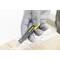 A gloved hand holds a yellow utility knife and opens a box sealed with adhesive tape.