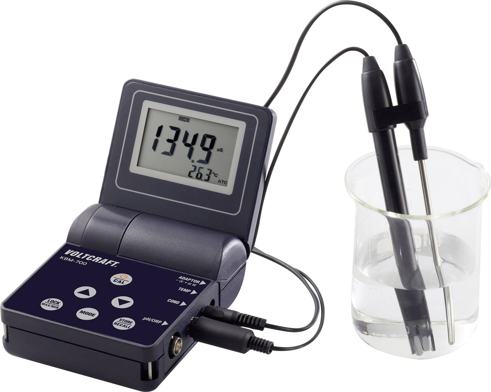 A digital multimeter displays '1349 µS' and '26.3 °C'. Two probes are inserted into a beaker of liquid for measurement.
