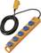 Orange extension cord reel with five blue covered power sockets and a yellow in-line safety switch, coiled black cable on a white background.