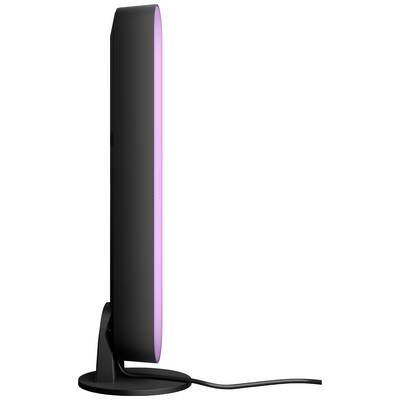 A sleek, black LED lamp in profile, emitting purple light, standing on a circular stand.