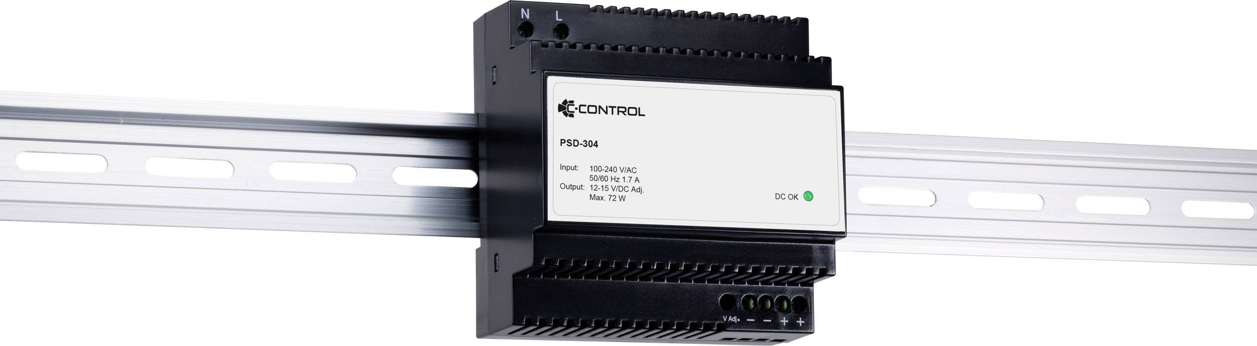 A black control unit, mounted on a metal rail, displays specifications such as input voltage and current strength on a white label.