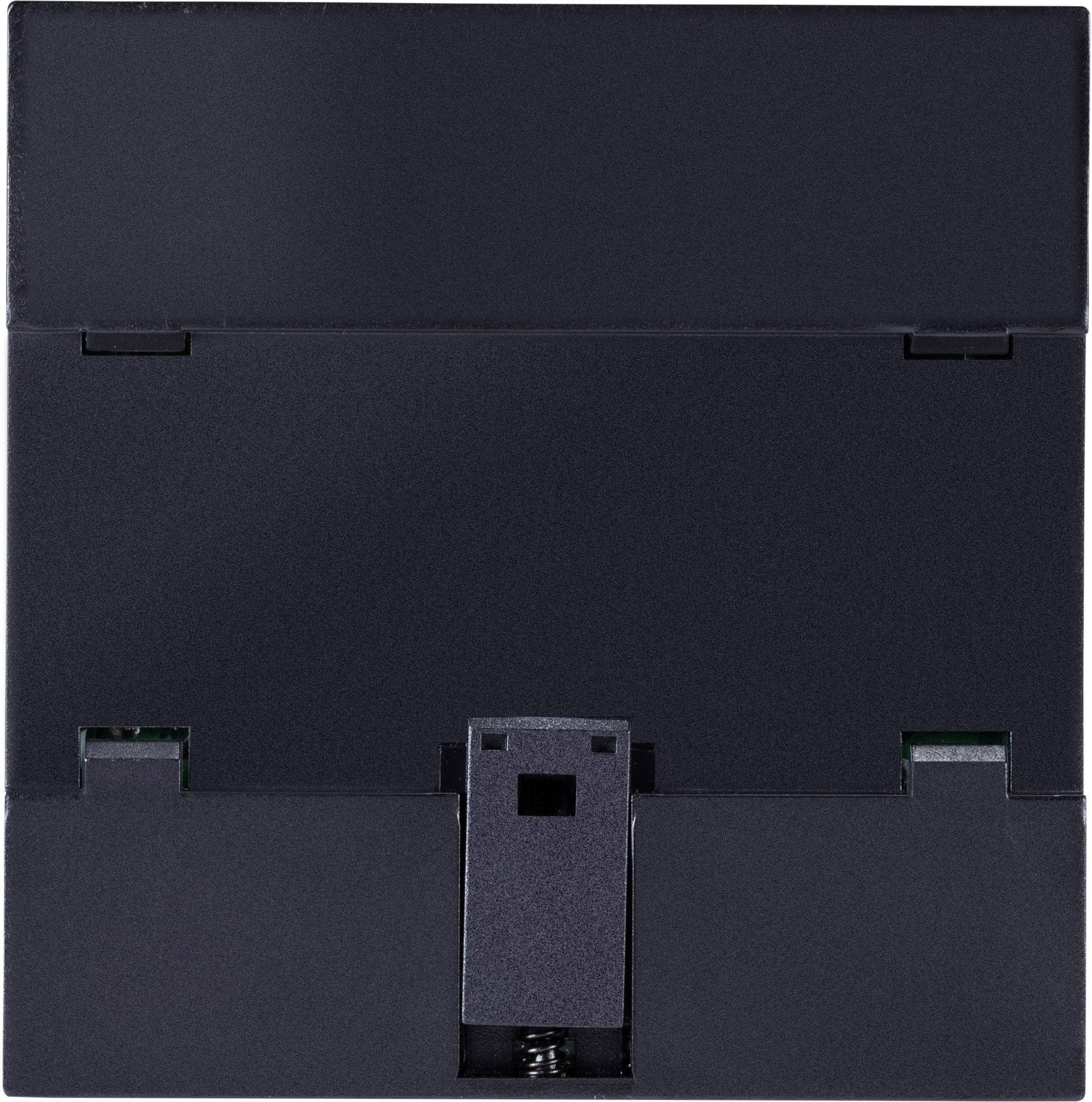 A black plastic frame with rectangular cut-outs and a spring clip in the centre.