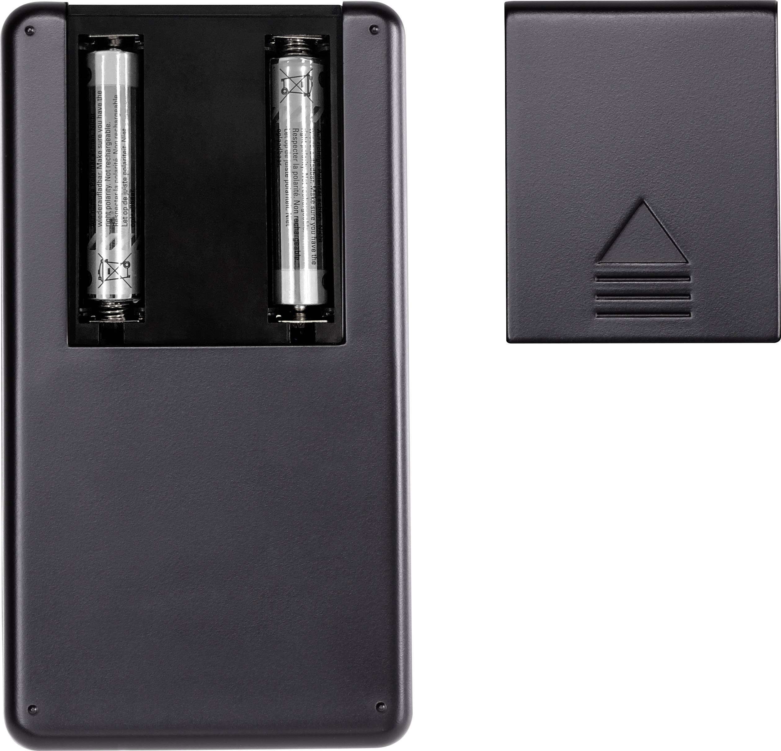 Back of a remote control with visible battery compartment and two batteries. Battery compartment cover placed separately beside it.